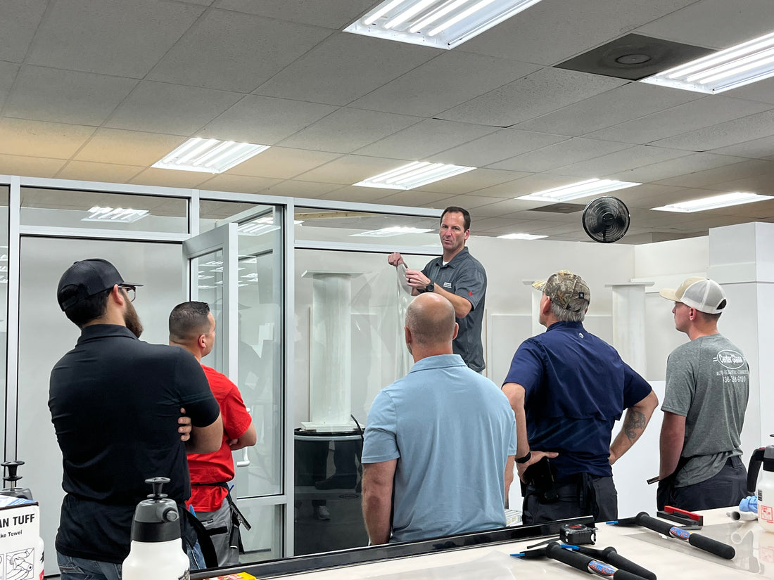 Group of employees in office, looking at products