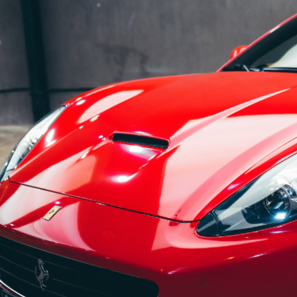 close up of a red car hood