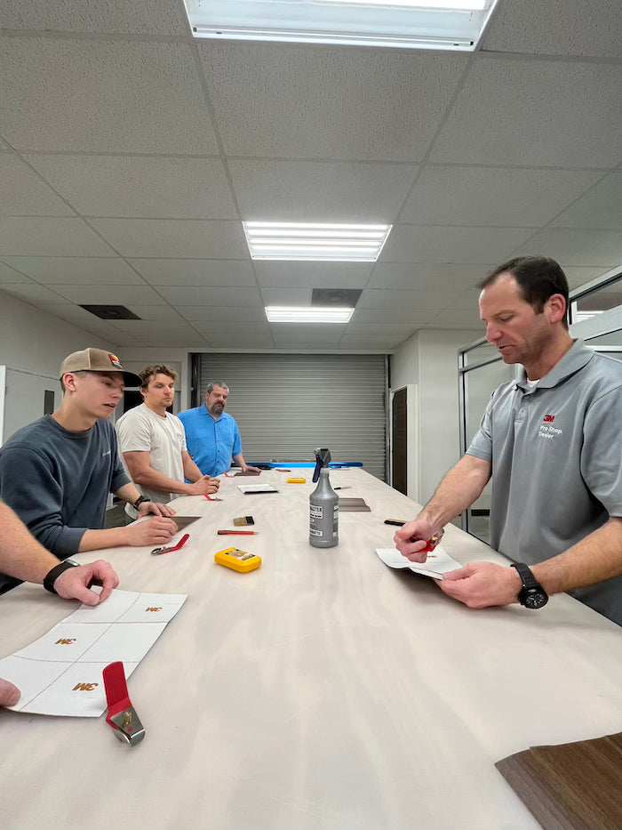 di-noc installation class with teacher and students