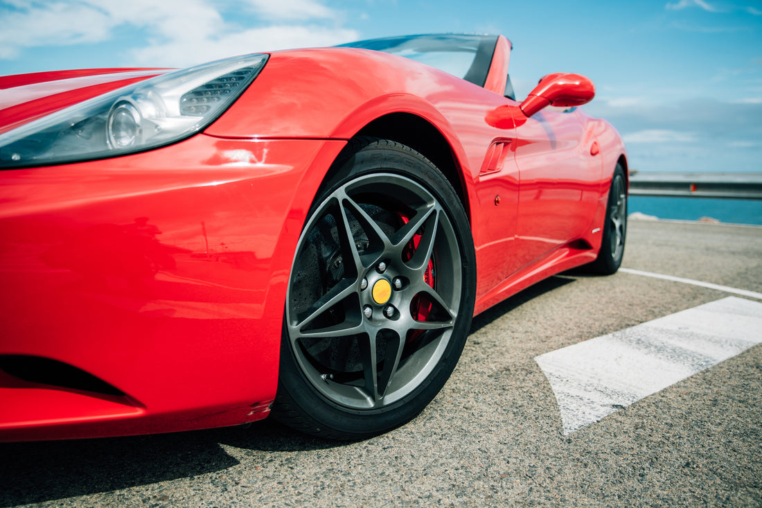 Red sports car wheel close up