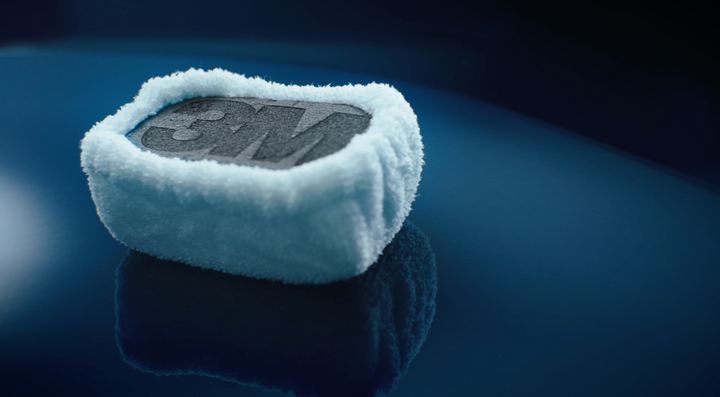 3m ceramic coating block on top of a blue car