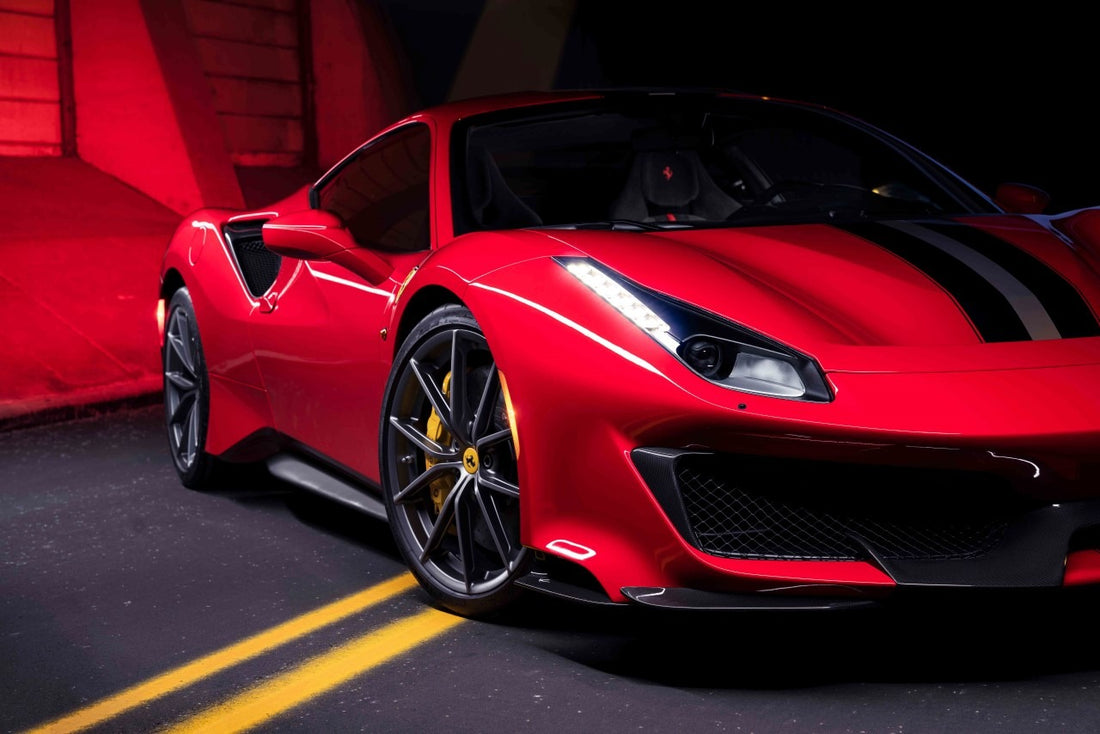 Ferrari displayed in warehouse, showcasing side of car